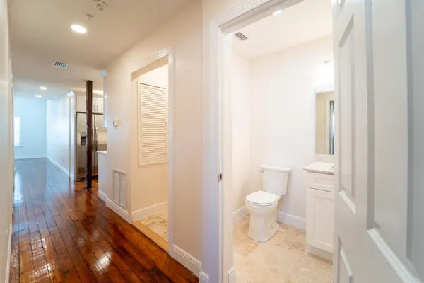 a bathroom with a toilet and shower