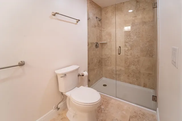 a bathroom with a sink a toilet and vanity