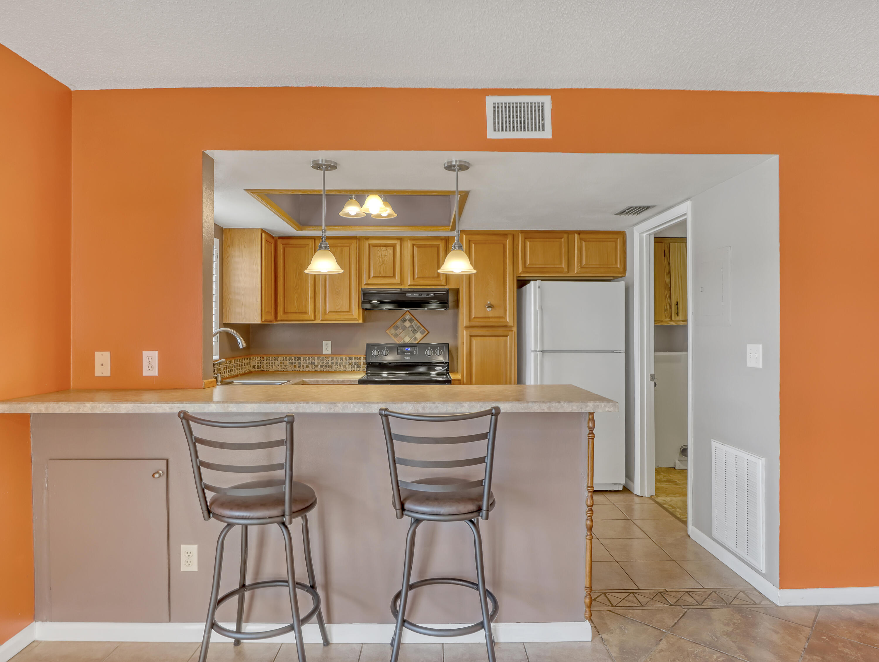 592 North Wickham Road, Unit 18 Melbourne, FL 32935 - Photo 11 of 29 a kitchen with a table and chairs in it