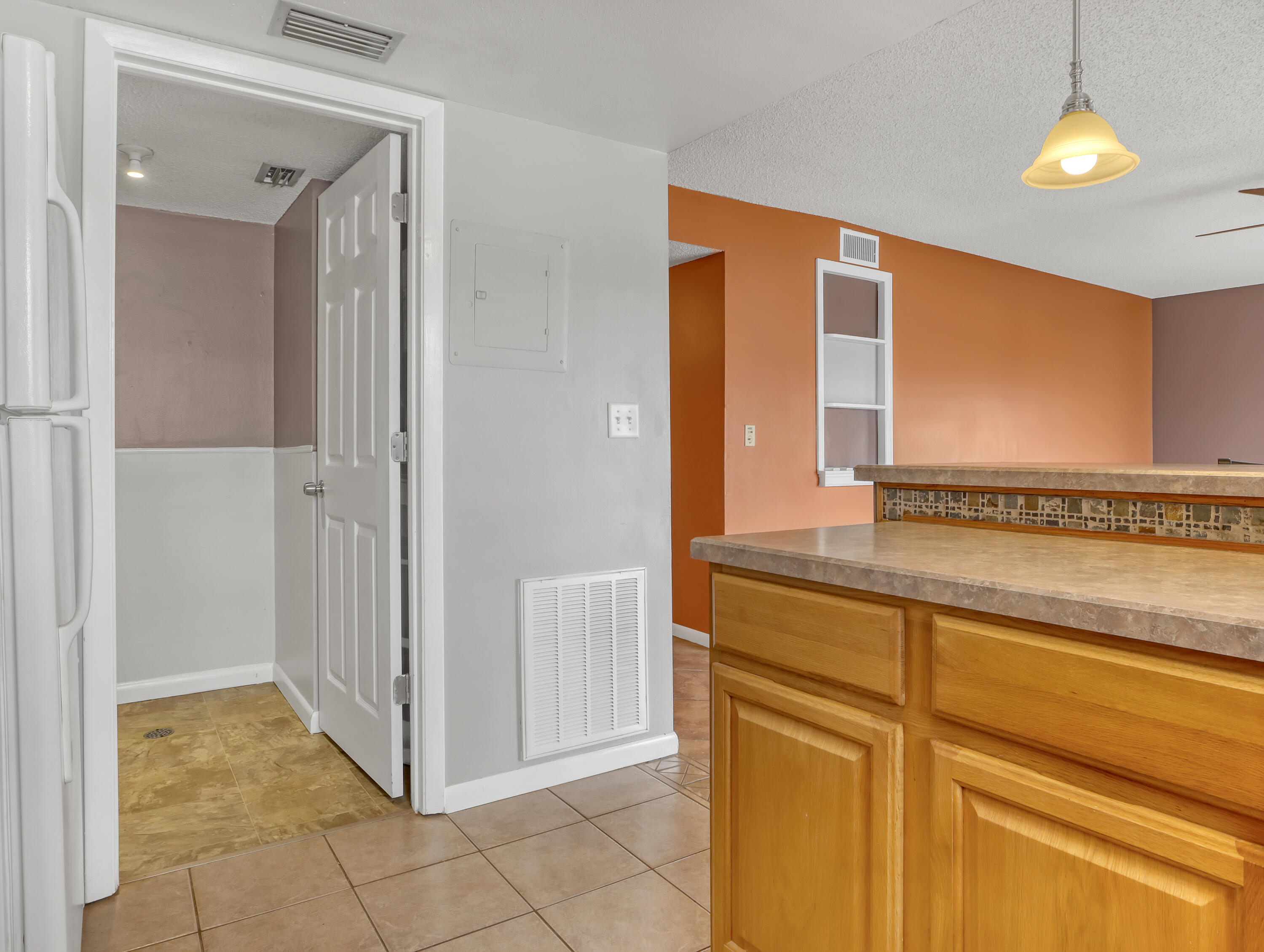 592 North Wickham Road, Unit 18 Melbourne, FL 32935 - Photo 14 of 29 a view of a hallway to front door