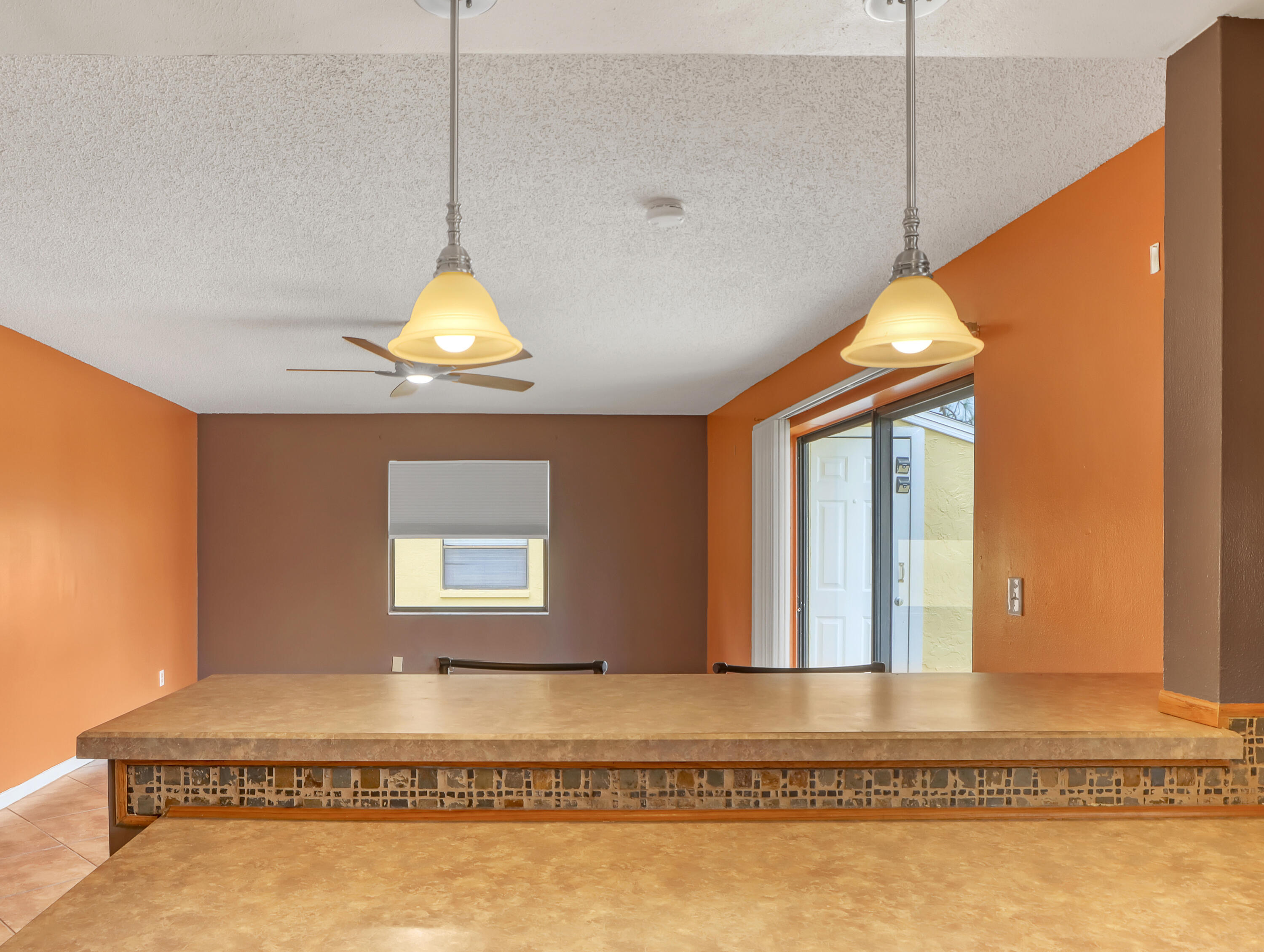 592 North Wickham Road, Unit 18 Melbourne, FL 32935 - Photo 15 of 29 a room that has a rug and a wooden floor