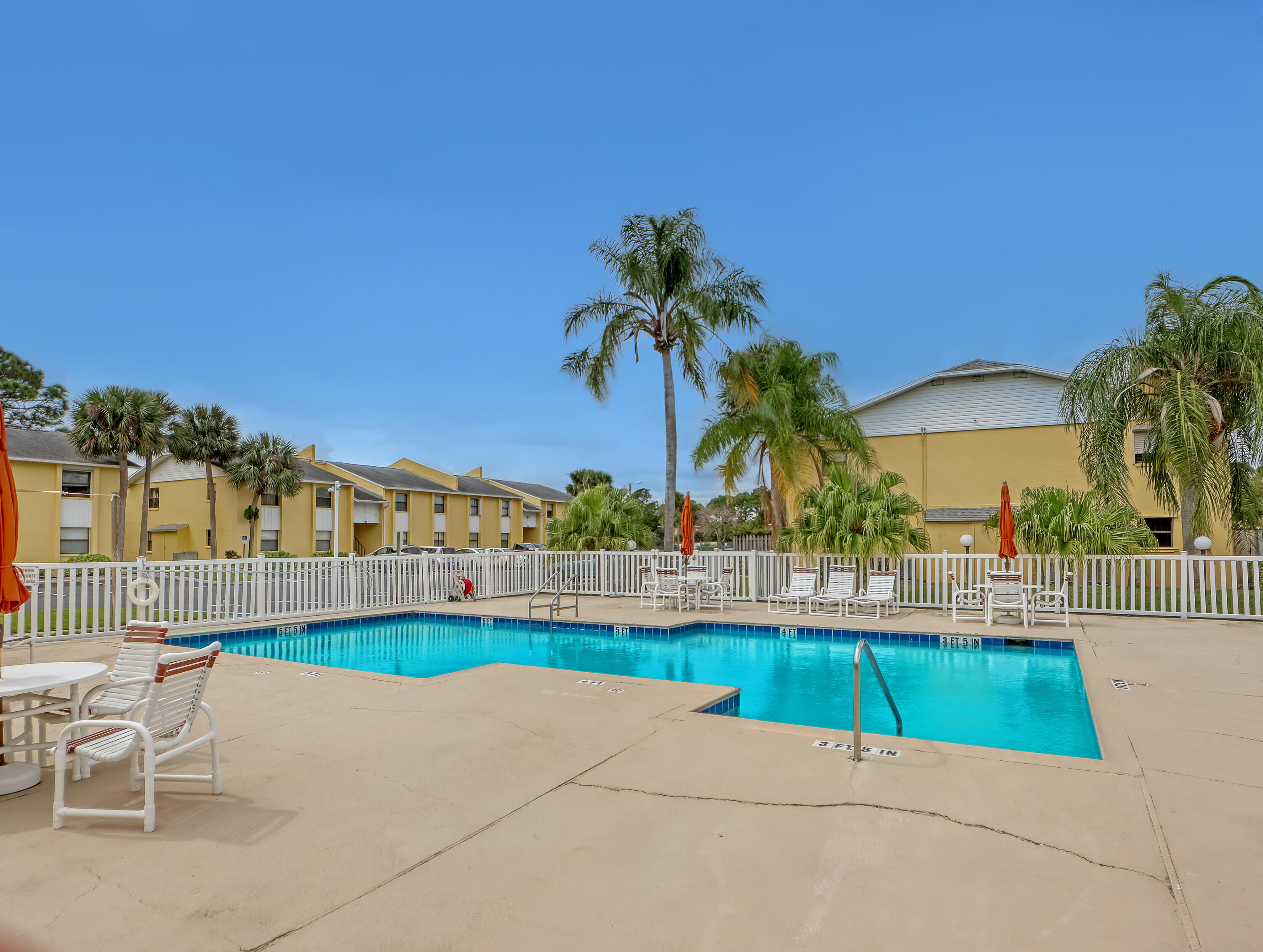 592 North Wickham Road, Unit 18 Melbourne, FL 32935 - Photo 29 of 29 a view of a garden with a lounge chair