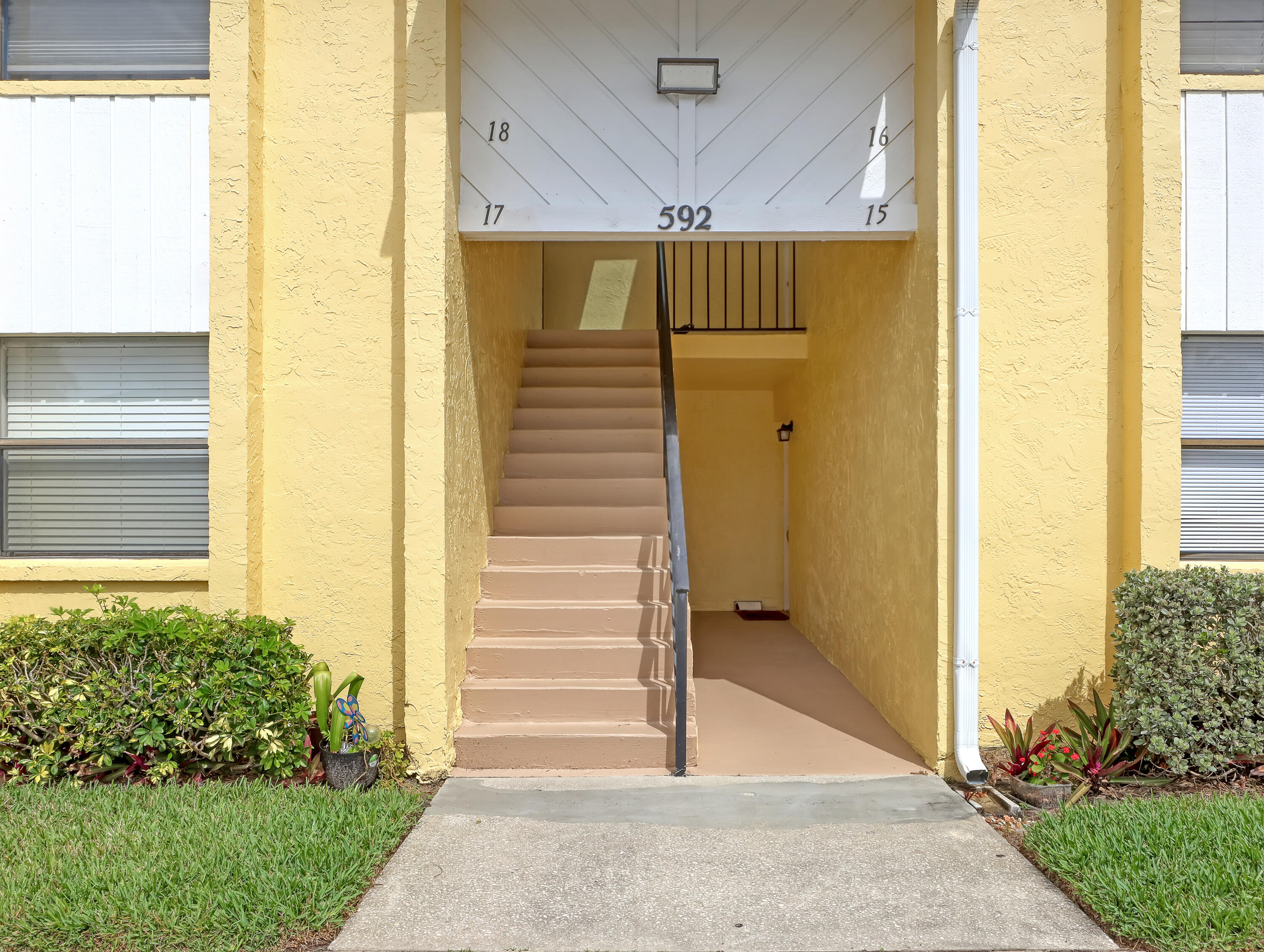 592 North Wickham Road, Unit 18 Melbourne, FL 32935 - Photo 4 of 29 a view of a entryway door back of the house