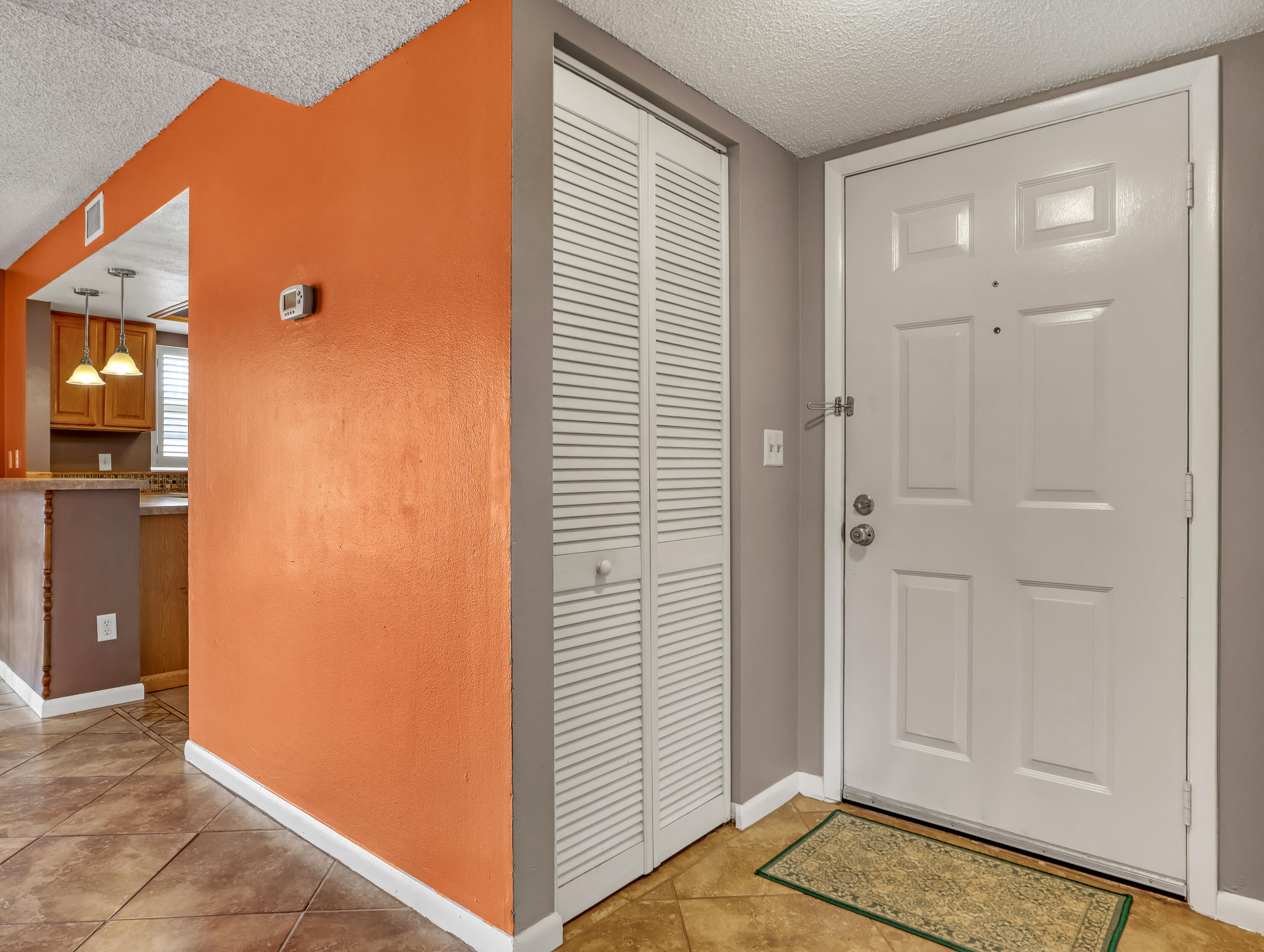 592 North Wickham Road, Unit 18 Melbourne, FL 32935 - Photo 6 of 29 a view of a livingroom with wooden floor and closet