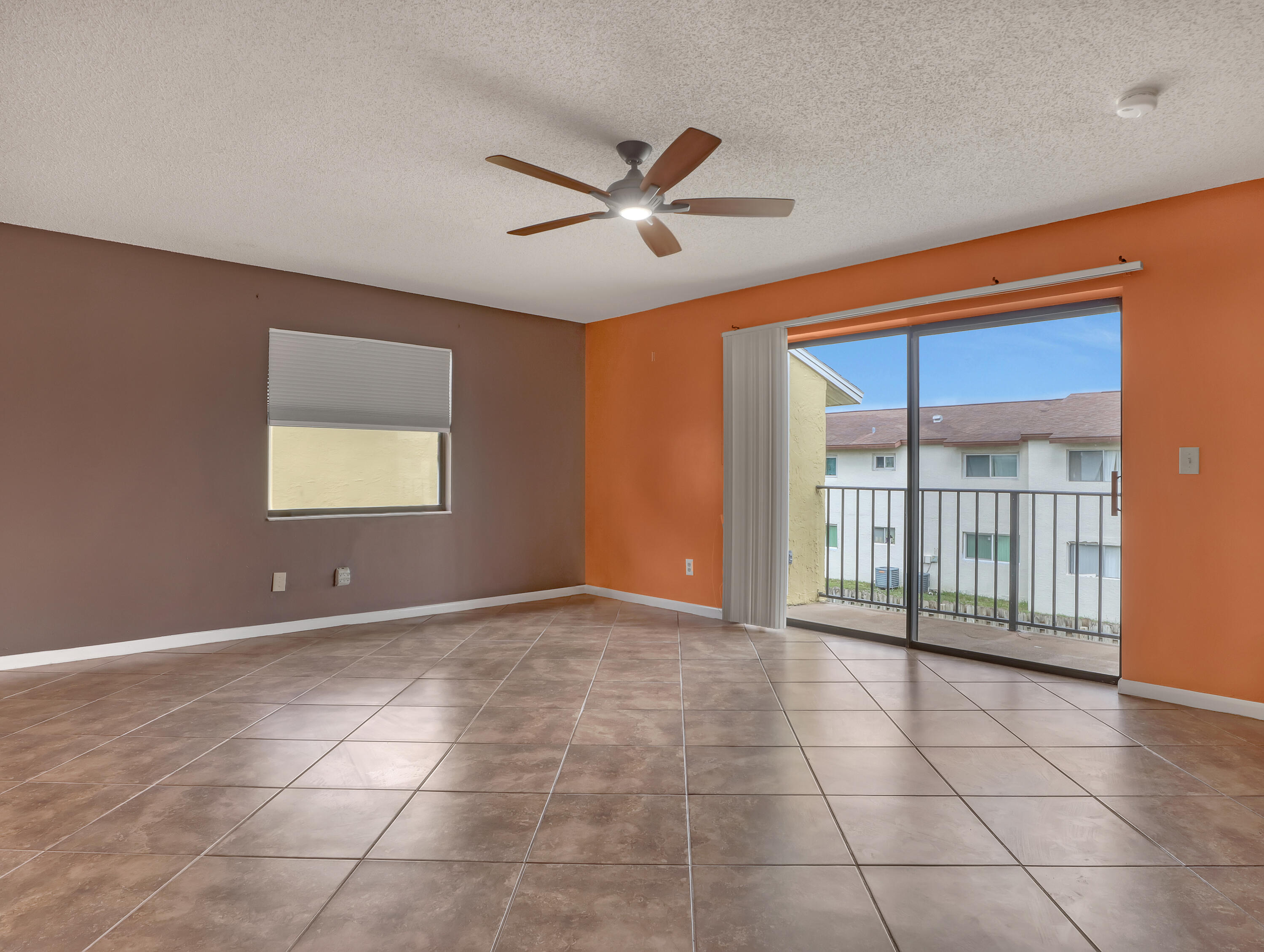 592 North Wickham Road, Unit 18 Melbourne, FL 32935 - Photo 8 of 29 a view of an empty room with a window