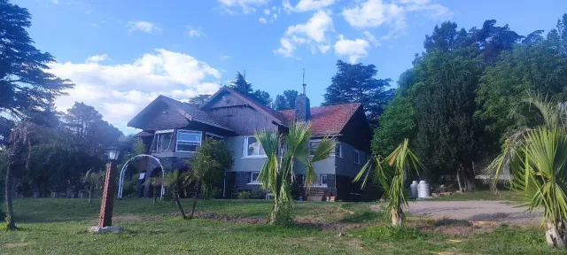 a view of a patio with a table and chairs