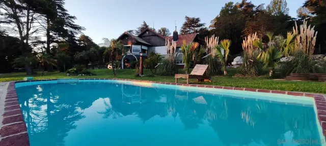 swimming pool view with a lake view