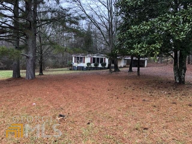 255 Gilbert Road Jefferson, GA 30549 - Photo 1 of 1 a house with trees in front of it
