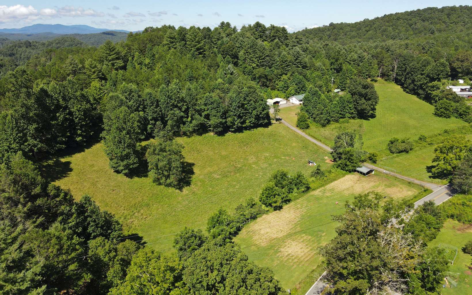521 Hanging Dog Road Murphy, NC 28906 - Photo 55 of 57 a view of a lake with a yard