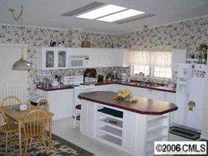 364 Sandburg Road Union Grove, NC 28689 - Photo 2 of 7 a kitchen with a sink and cabinets