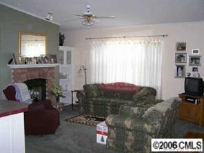 364 Sandburg Road Union Grove, NC 28689 - Photo 3 of 7 a living room with furniture and a fireplace