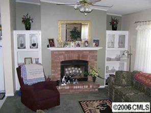 364 Sandburg Road Union Grove, NC 28689 - Photo 7 of 7 a living room with furniture and a fireplace