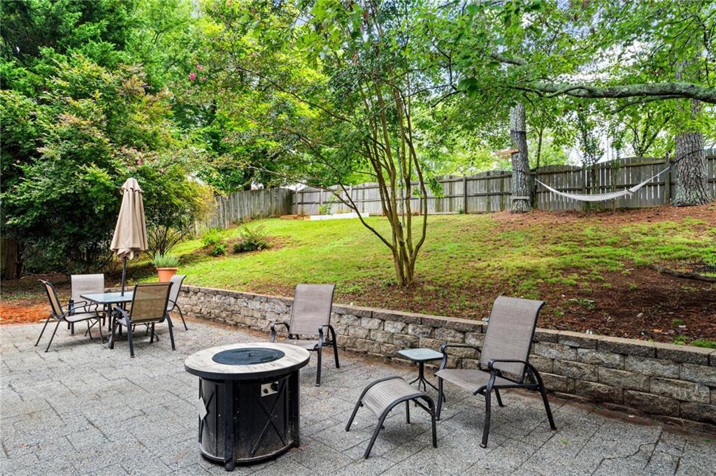 1996 Morning Walk Northwest Acworth, GA 30102 - Photo 20 of 22 a view of a patio with table and chairs potted plants and a large tree