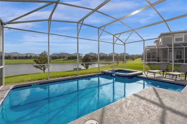 a view of a swimming pool with a lake view