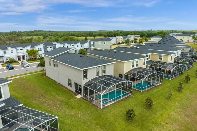 an aerial view of a house with a swimming pool