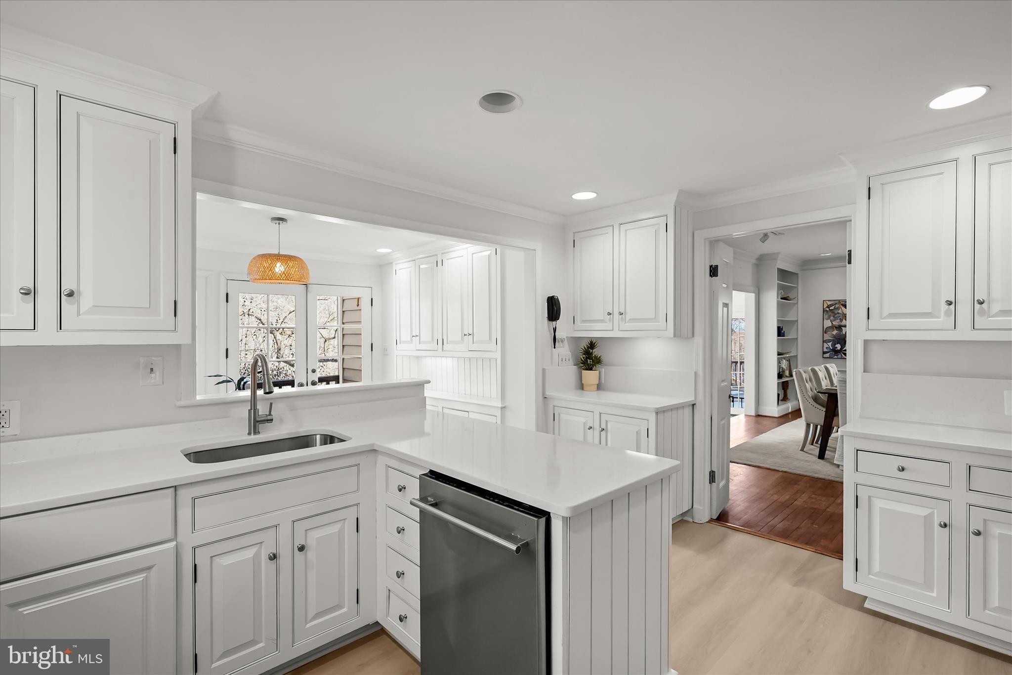 1727 Hoban Road Northwest Washington, DC 20007 - Photo 11 of 25 a kitchen with white cabinets and sink