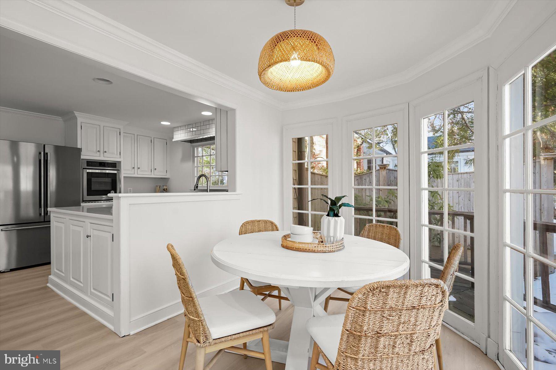 1727 Hoban Road Northwest Washington, DC 20007 - Photo 12 of 25 a kitchen with stainless steel appliances granite countertop a dining table and chairs
