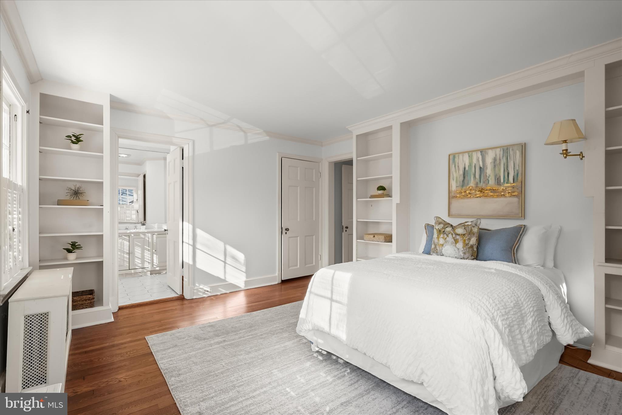 1727 Hoban Road Northwest Washington, DC 20007 - Photo 17 of 25 a spacious bedroom with a bed and wooden floor
