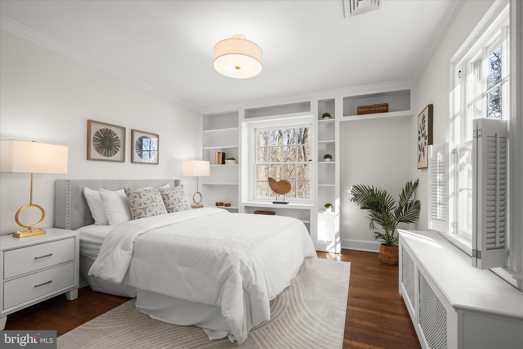 1727 Hoban Road Northwest Washington, DC 20007 - Photo 18 of 25 a spacious bedroom with a bed and a couch