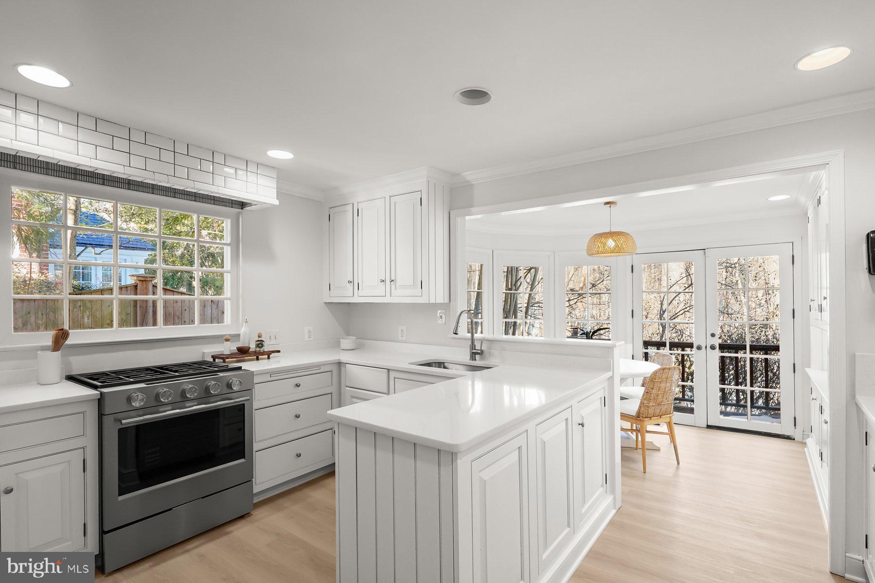 1727 Hoban Road Northwest Washington, DC 20007 - Photo 10 of 25 a kitchen with a stove a sink and a refrigerator