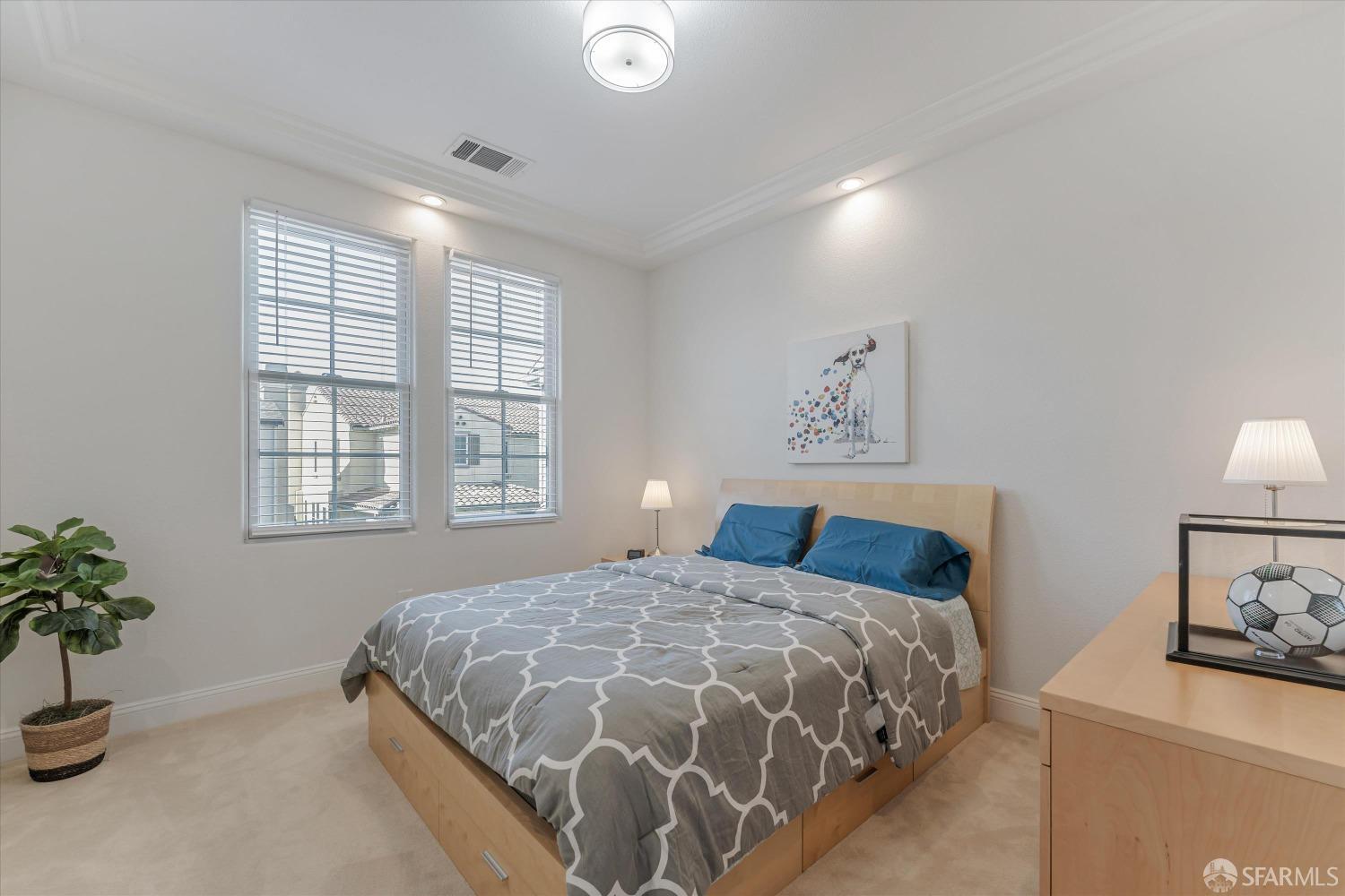 10 Jouett Square Alameda, CA 94501 - Photo 19 of 23 a bedroom with a bed and a potted plant