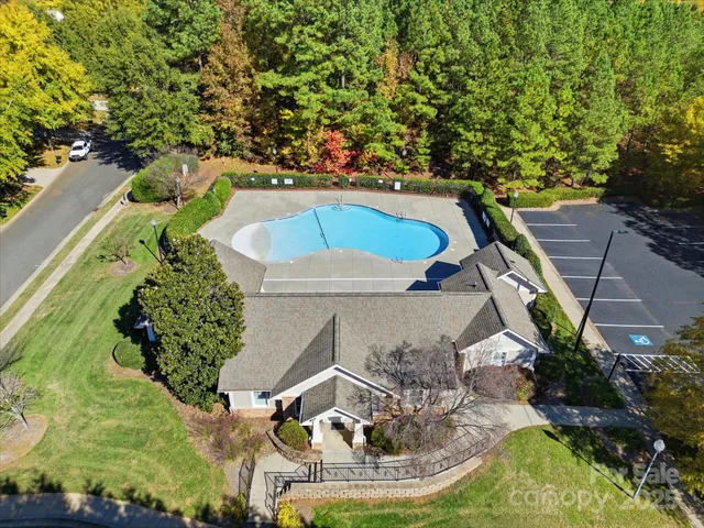 a view of a swimming pool with a yard
