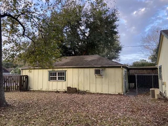 a house with trees in the background