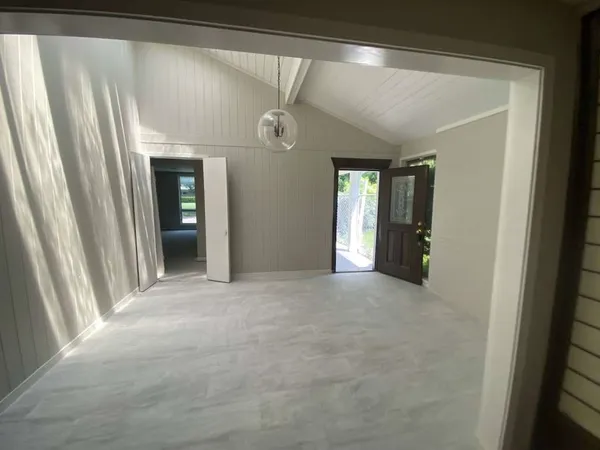 a view of a hallway with an entryway
