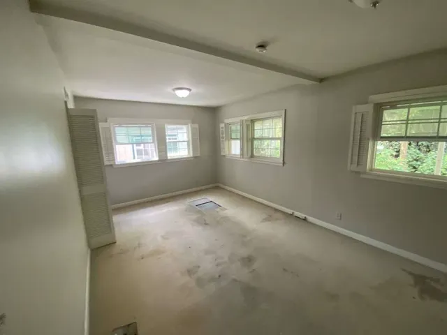 an empty room with windows