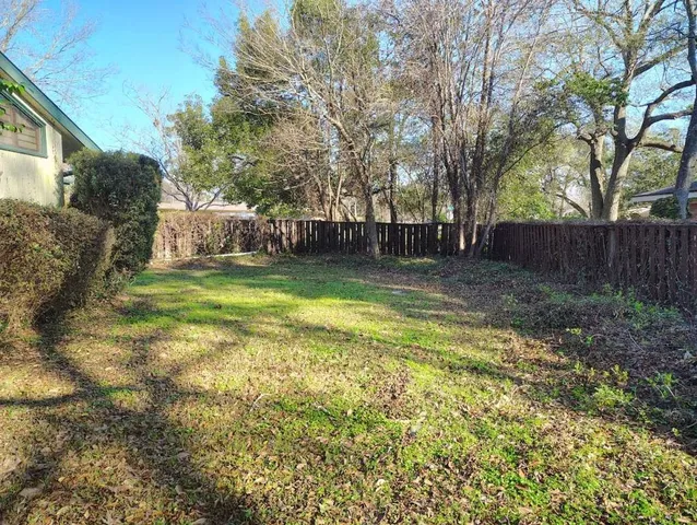 a view of a backyard with a small cabin