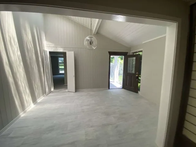 a view of a hallway with an entryway