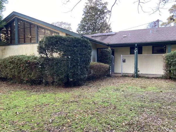 a view of a house with a garden