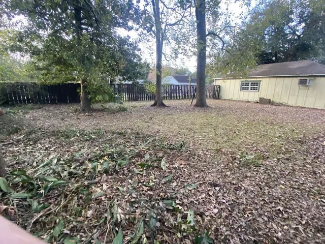 a backyard of a house with lots of green space