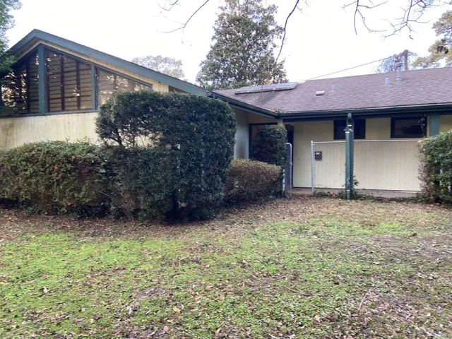 a view of a house with a garden