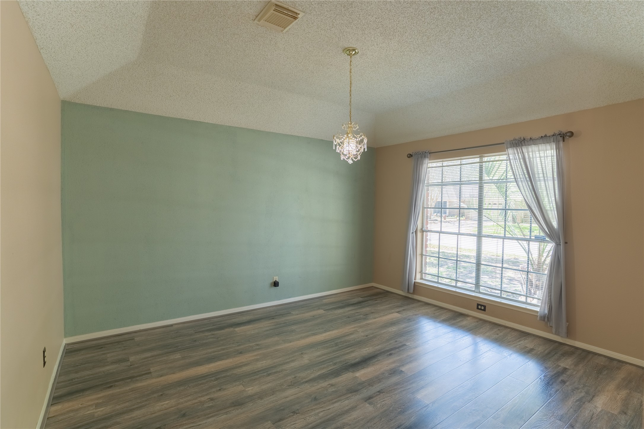 4007 Spring Forest Drive Pearland, TX 77584 - Photo 13 of 39 wooden floor in an empty room with a window