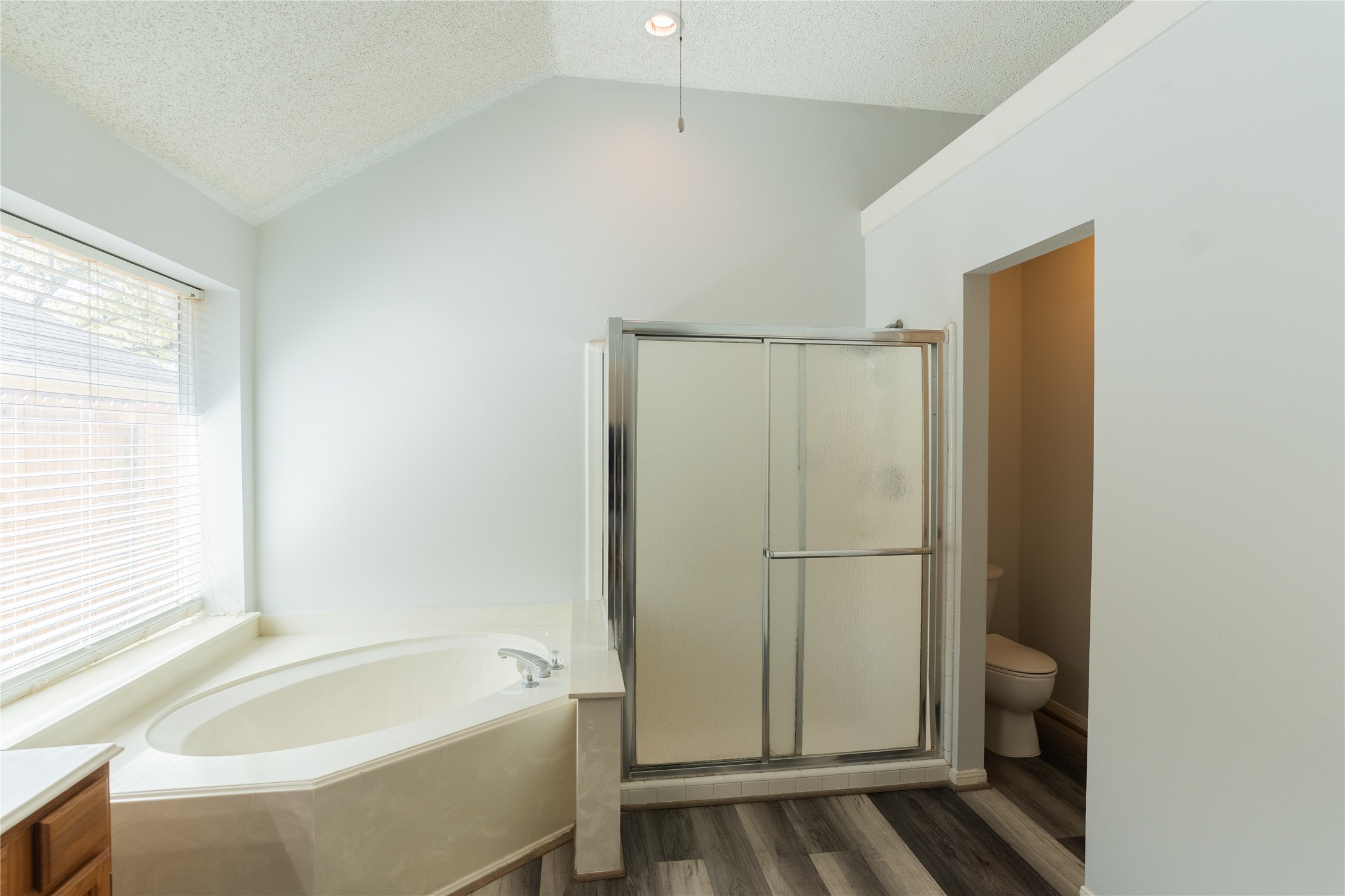 4007 Spring Forest Drive Pearland, TX 77584 - Photo 18 of 39 a bathroom with a tub and shower