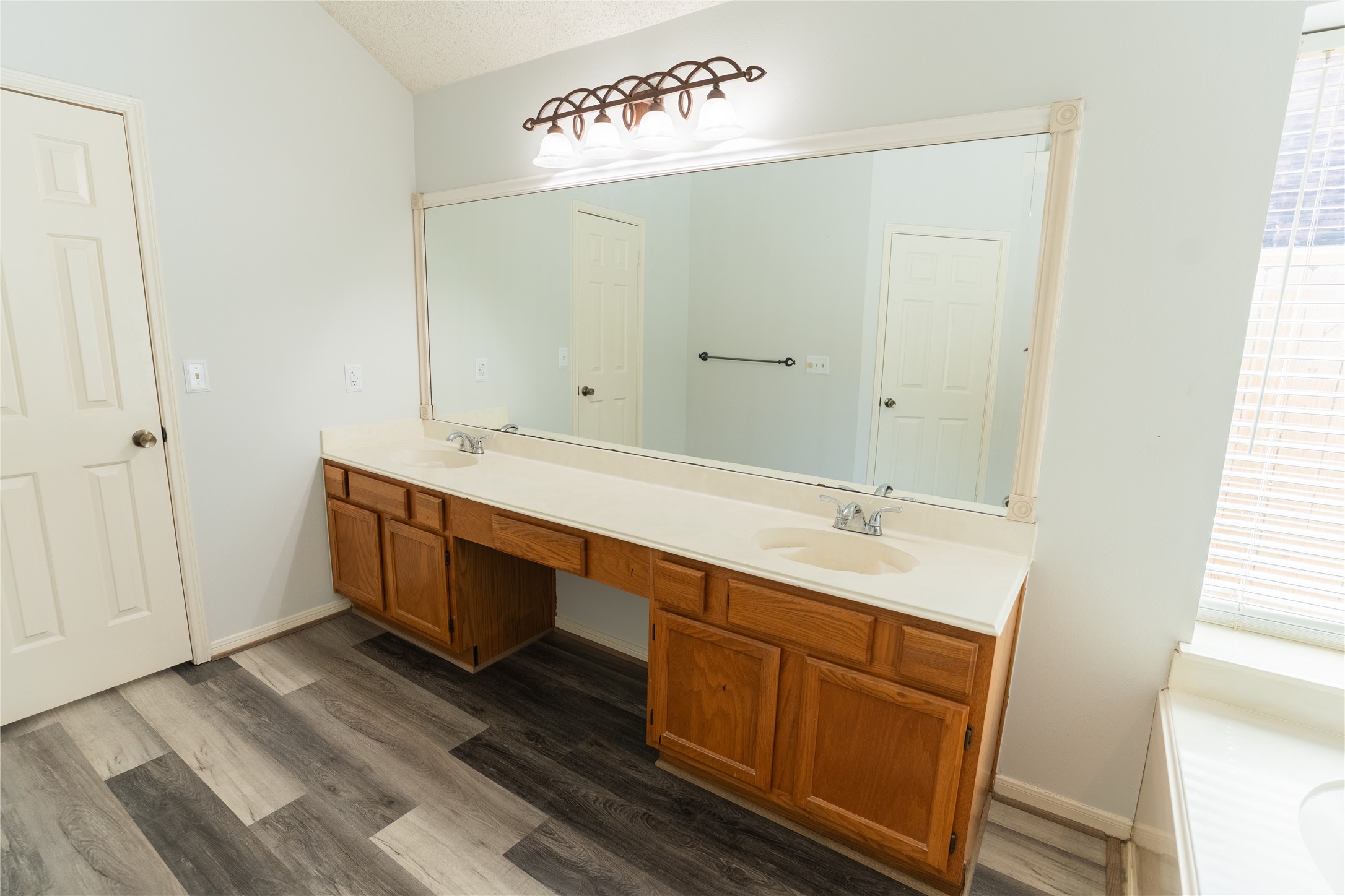 4007 Spring Forest Drive Pearland, TX 77584 - Photo 19 of 39 a bathroom with a double vanity sink and mirror
