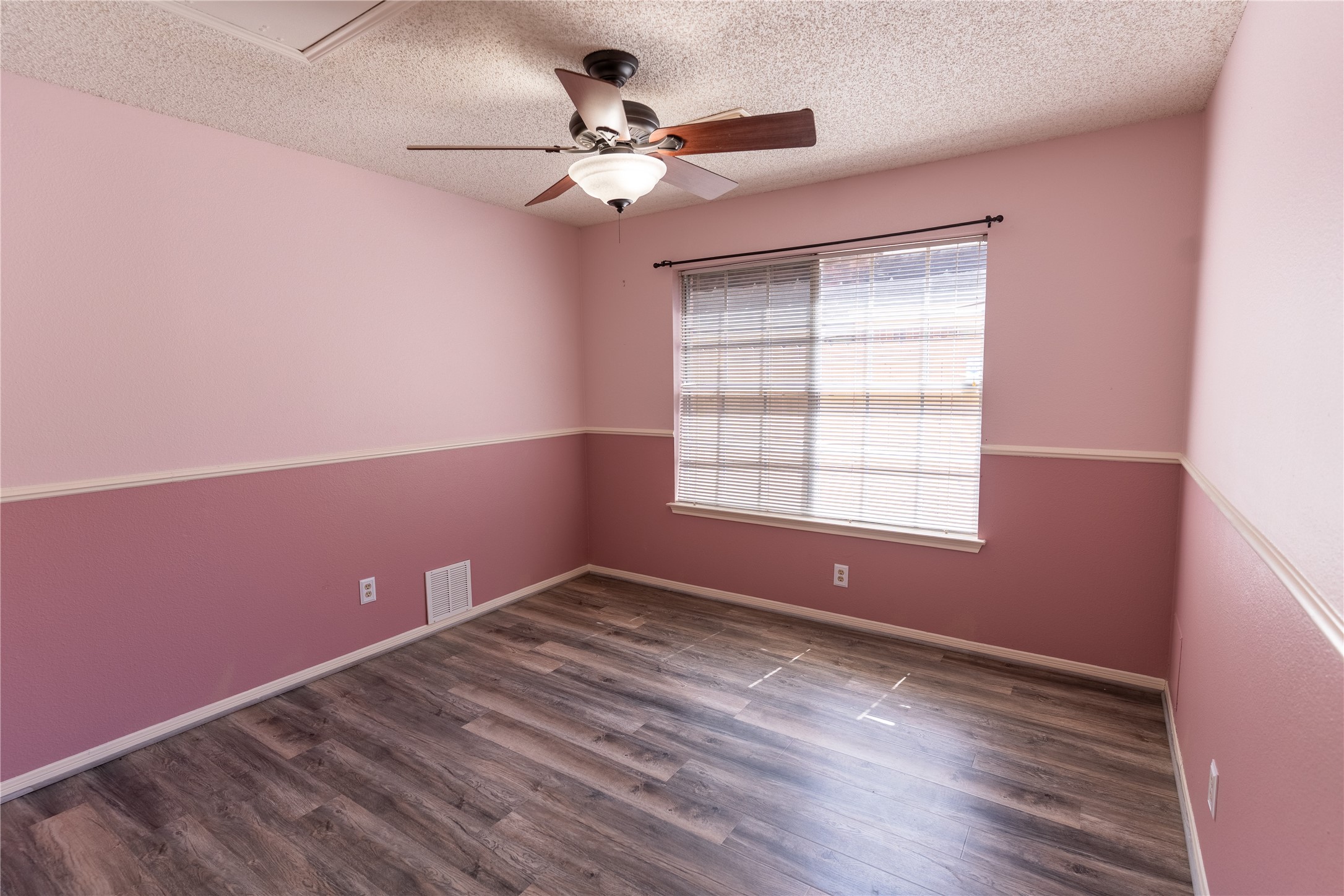 4007 Spring Forest Drive Pearland, TX 77584 - Photo 23 of 39 a view of empty room with wooden floor and fan