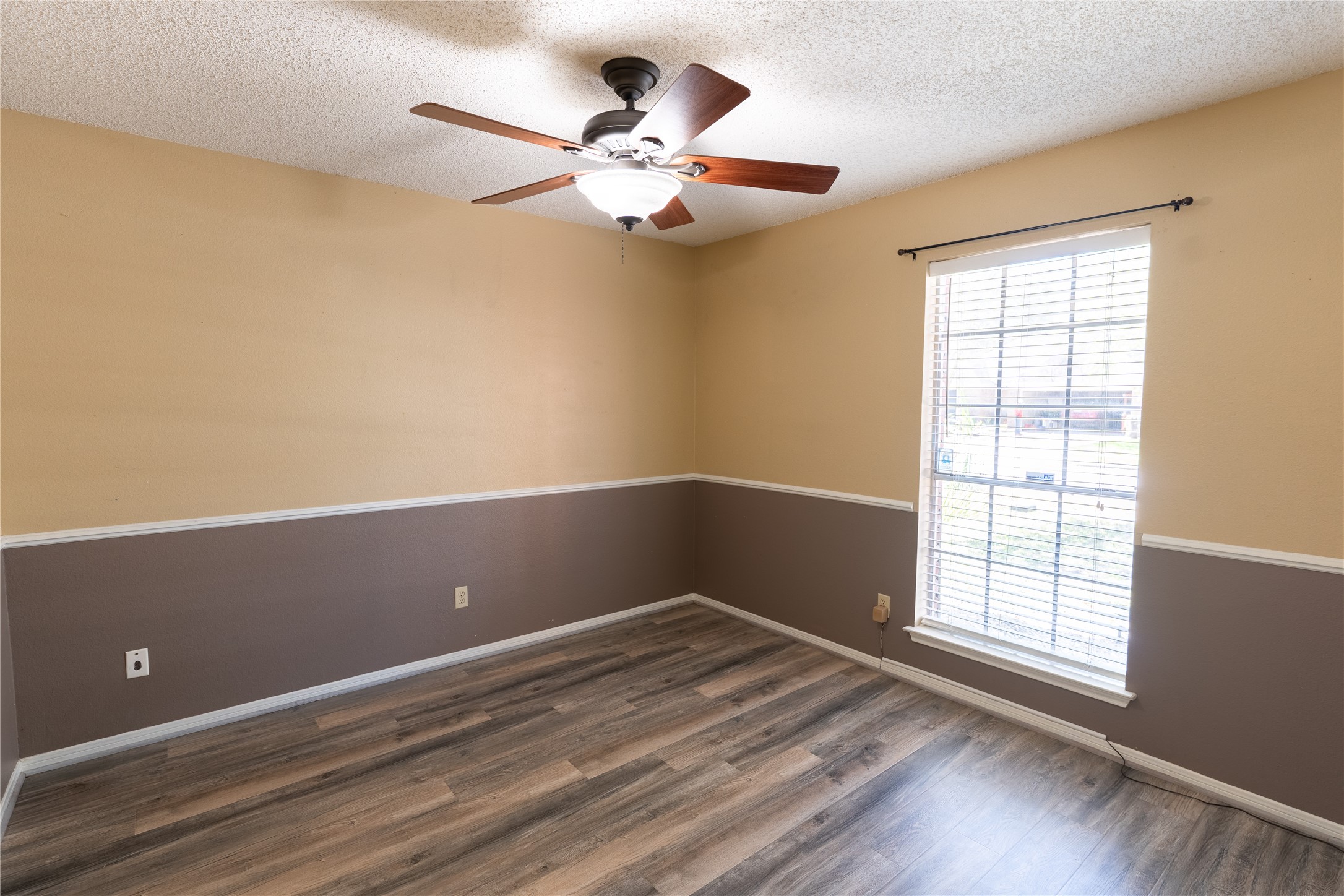4007 Spring Forest Drive Pearland, TX 77584 - Photo 25 of 39 a view of an empty room with wooden floor and a window