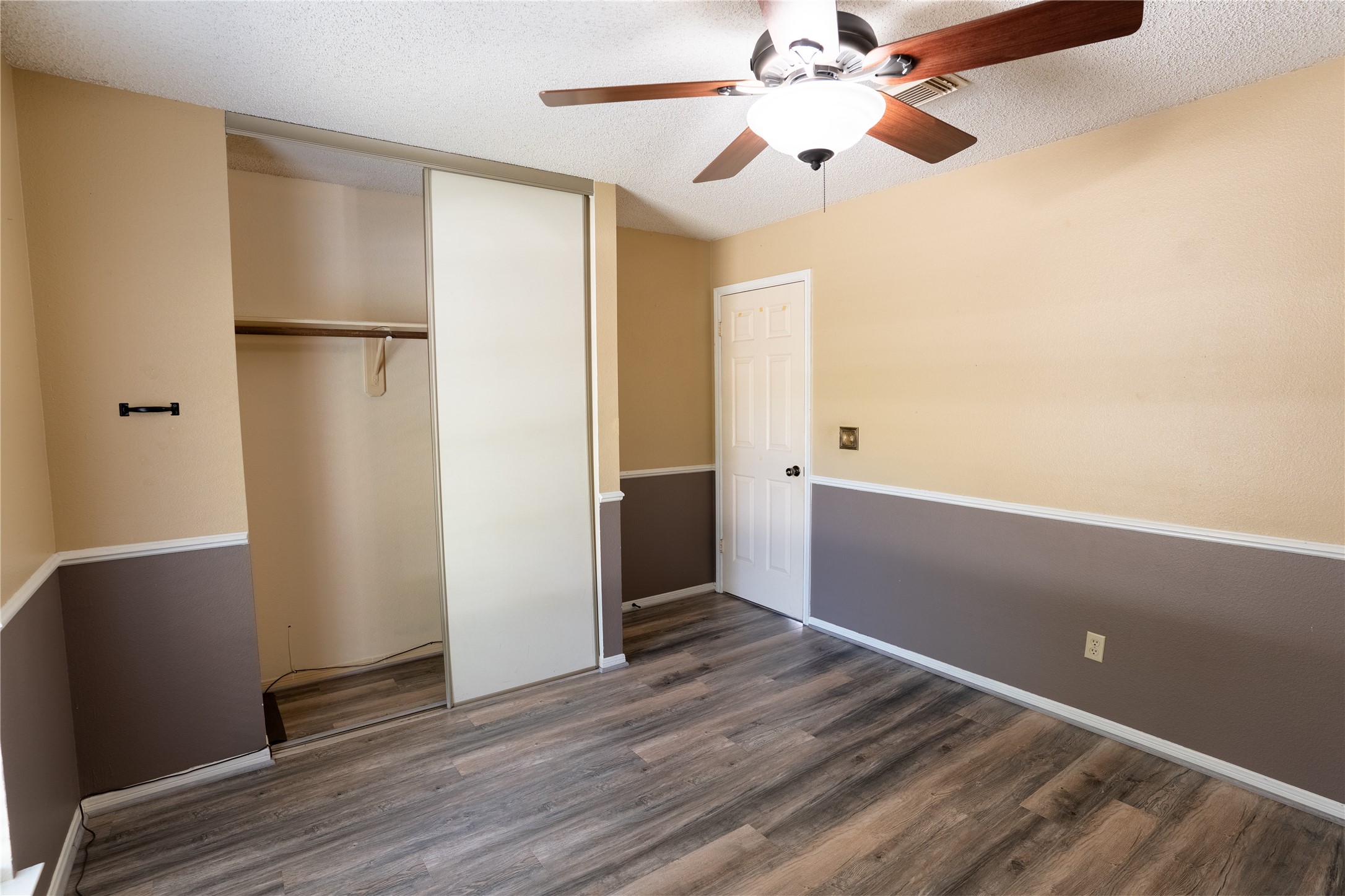 4007 Spring Forest Drive Pearland, TX 77584 - Photo 26 of 39 a view of empty room with wooden floor and fan