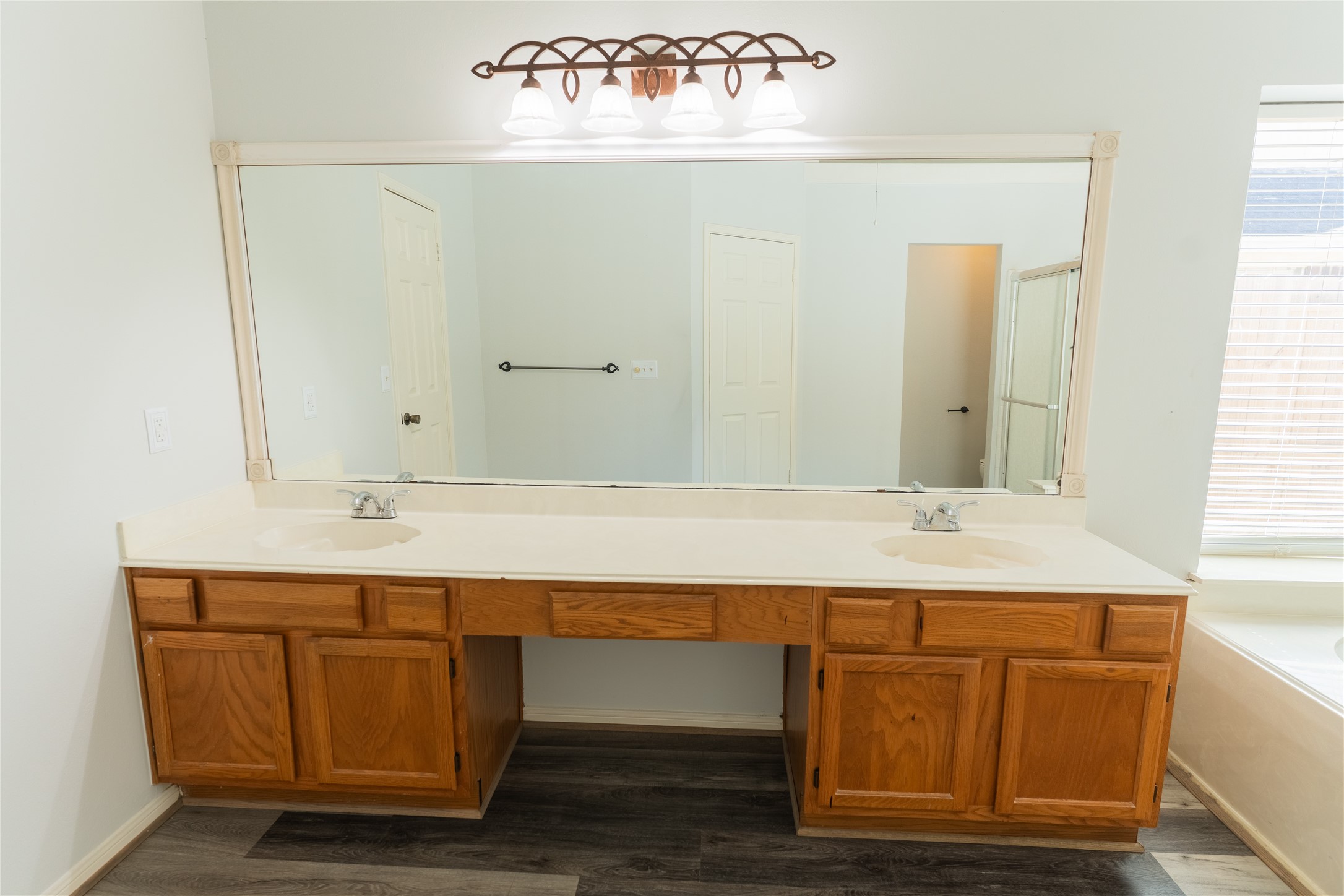 4007 Spring Forest Drive Pearland, TX 77584 - Photo 27 of 39 a bathroom with a sink and a mirror