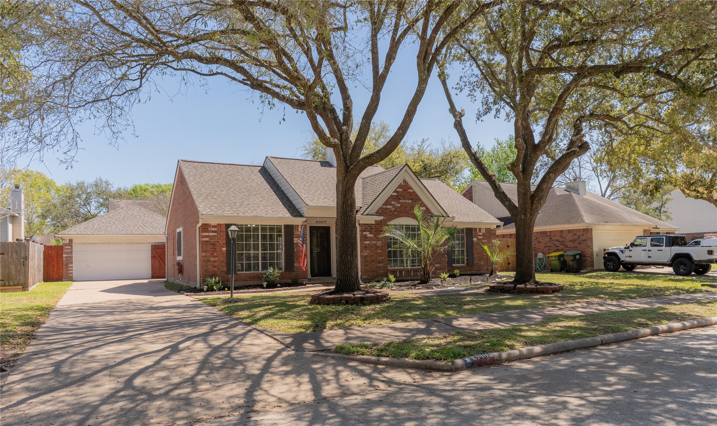 4007 Spring Forest Drive Pearland, TX 77584 - Photo 30 of 39 a view of a house with trees in front of it