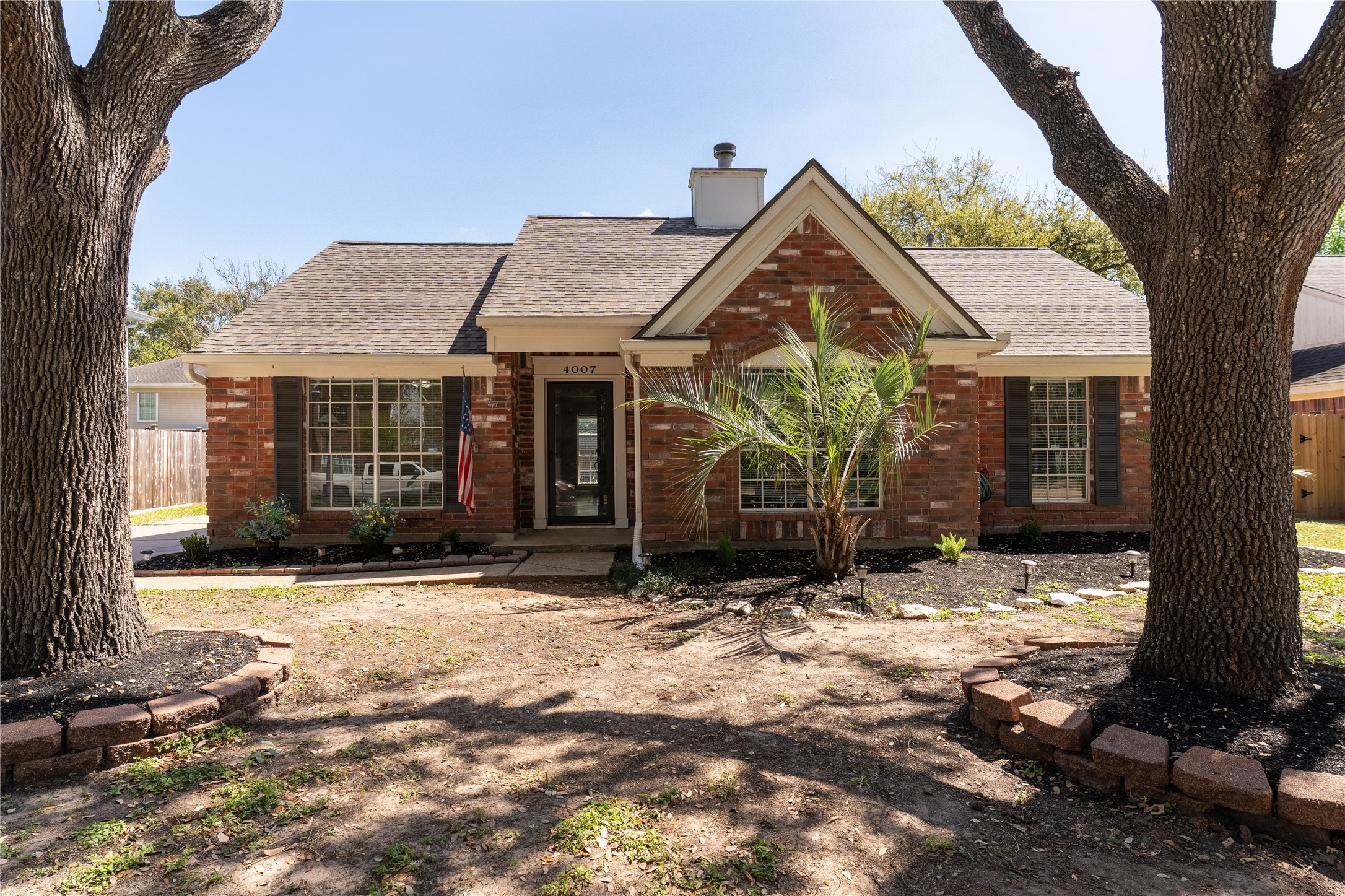 4007 Spring Forest Drive Pearland, TX 77584 - Photo 31 of 39 a view of a house with a yard