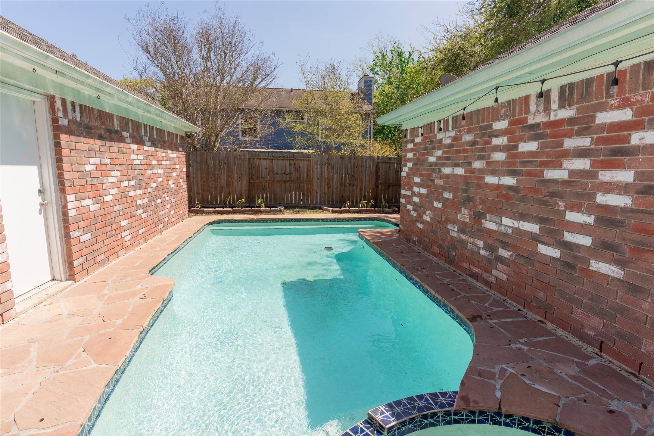 4007 Spring Forest Drive Pearland, TX 77584 - Photo 34 of 39 a backyard of a house with garden and wooden floors