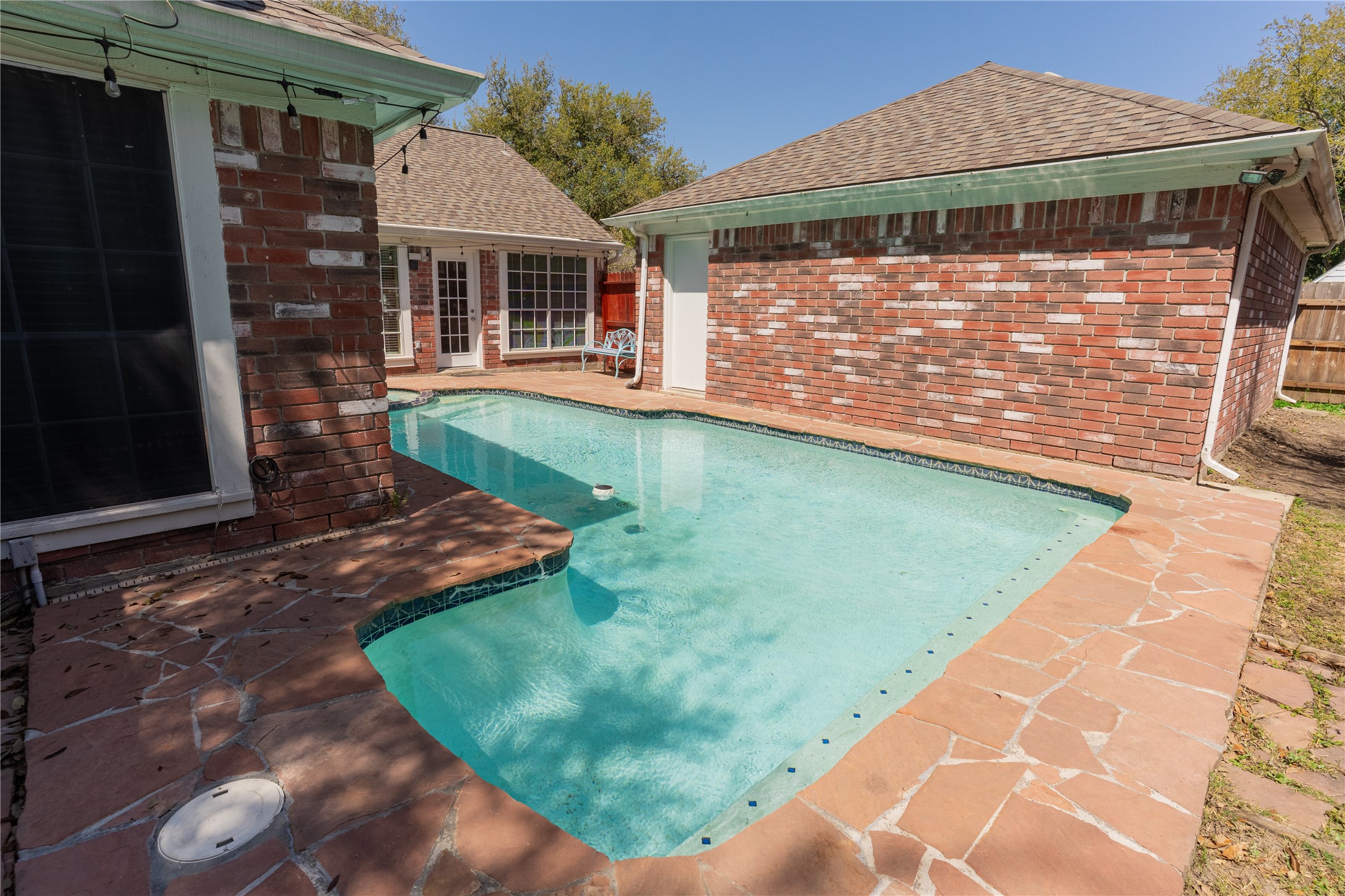 4007 Spring Forest Drive Pearland, TX 77584 - Photo 35 of 39 a front view of a house with garden