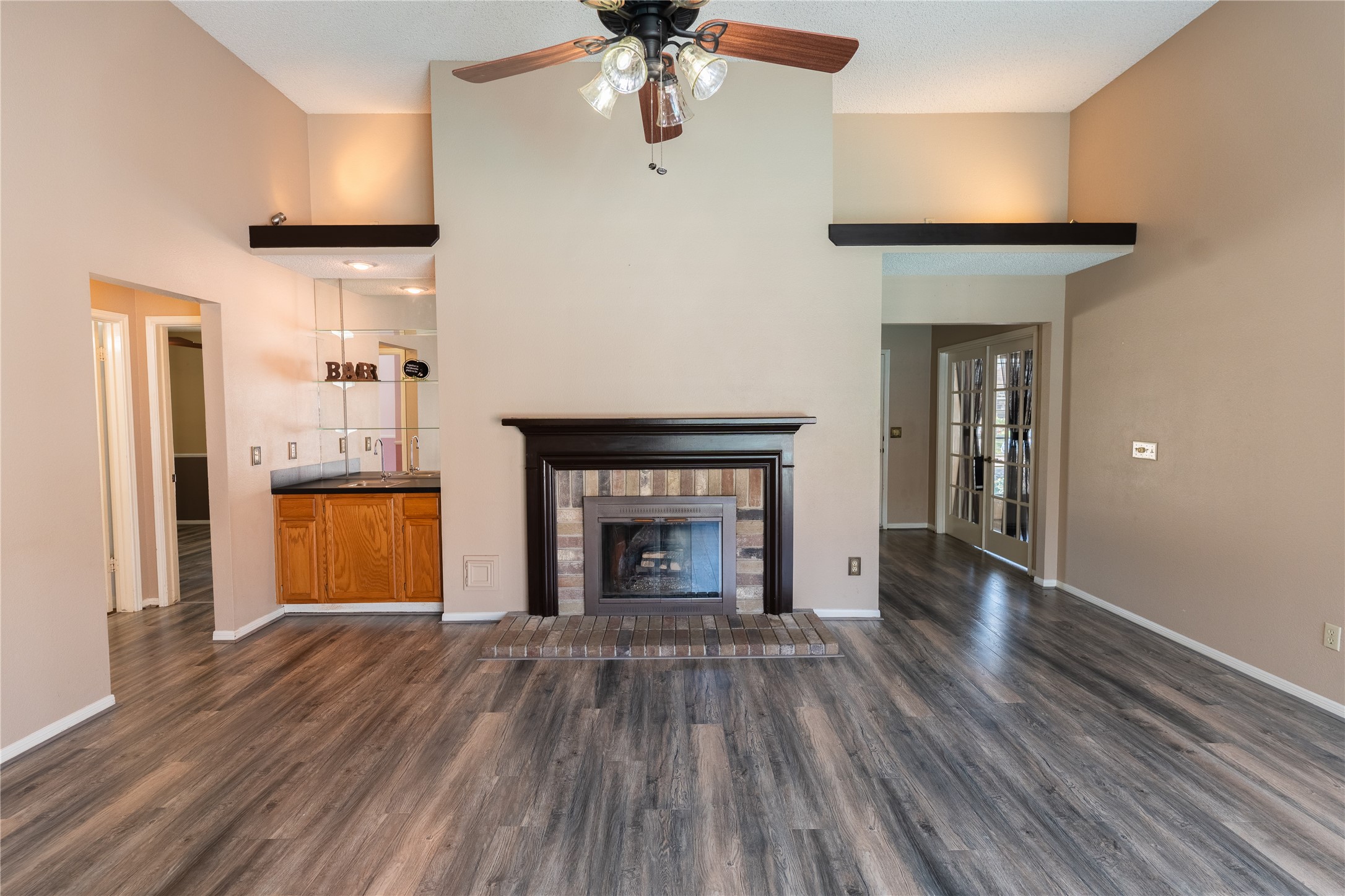 4007 Spring Forest Drive Pearland, TX 77584 - Photo 5 of 39 a view of an empty room with a fireplace and a window