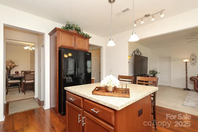 a kitchen with a sink a counter space and stainless steel appliances