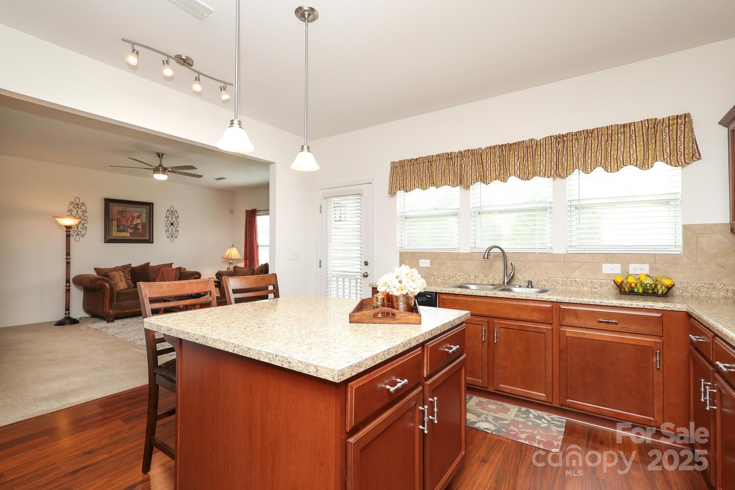 2104 Gillette Drive Clover, SC 29710 - Photo 12 of 33 a kitchen with a sink a counter top space and living room view