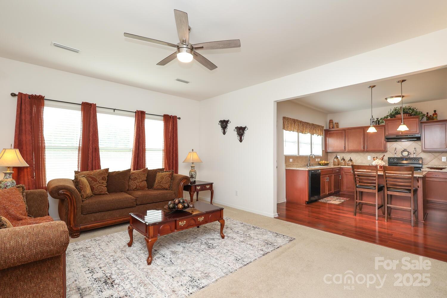2104 Gillette Drive Clover, SC 29710 - Photo 15 of 33 a living room with furniture a large window and a dining table