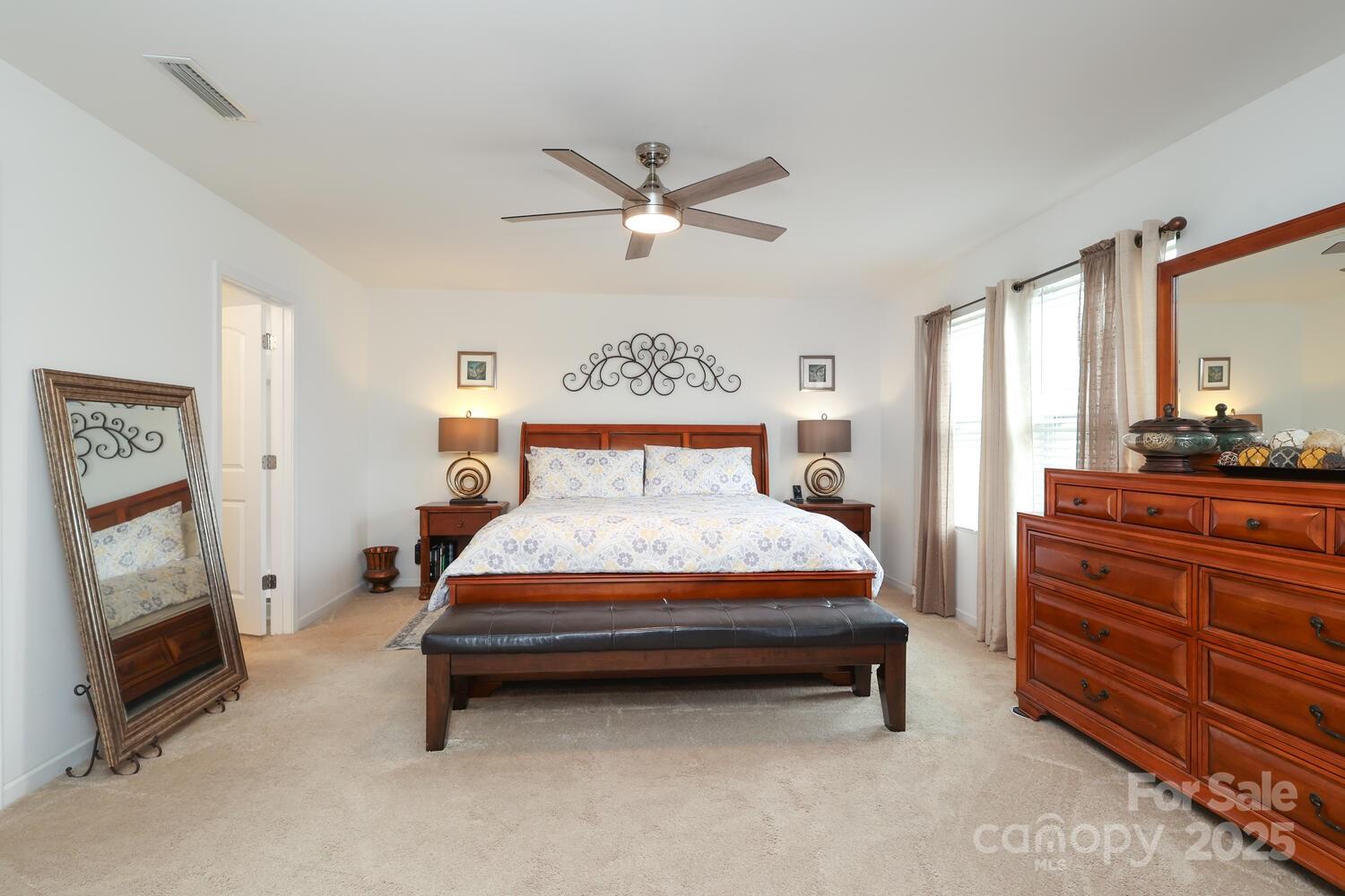 2104 Gillette Drive Clover, SC 29710 - Photo 22 of 33 a bedroom with a bed and a flat tv screen on the dresser